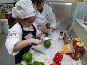 Children Cutting Up Peppers