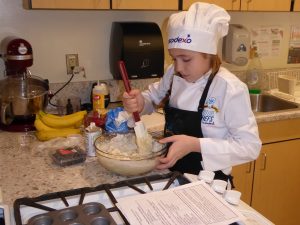 Child mixing a batter