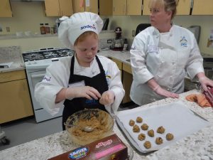Child making Chocolate Chip Cookies