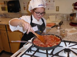 Children Cooking in Red Sauce