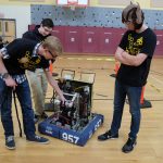 Children playing with robots