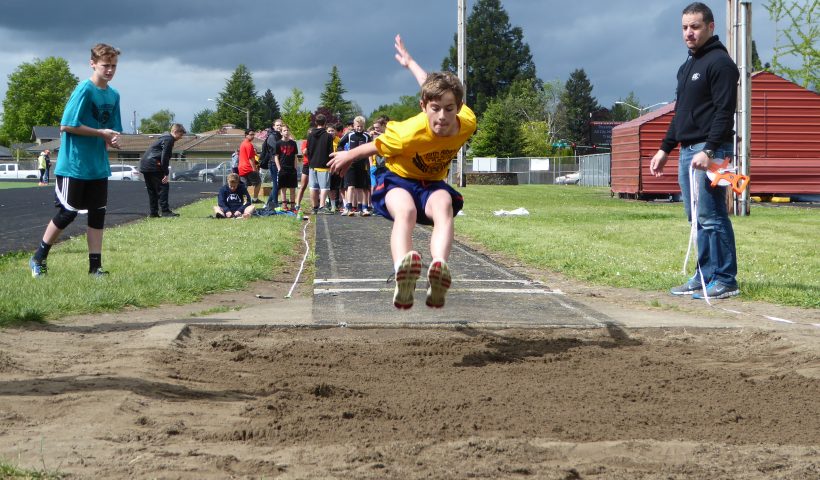 Child doing long jump