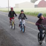 Kids riding bikes in the rain