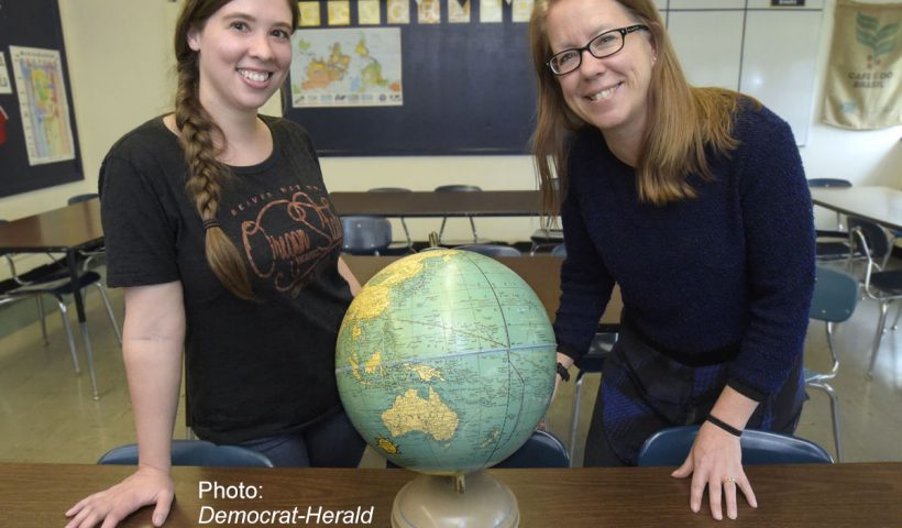 Teachers with a globe