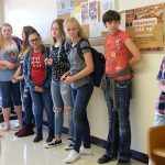 Teens standing in hallway