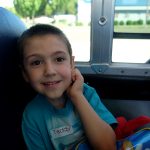 smiling boy on bus
