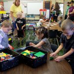 Kindergarten students playing with legos