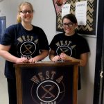 Student hosts greet diners