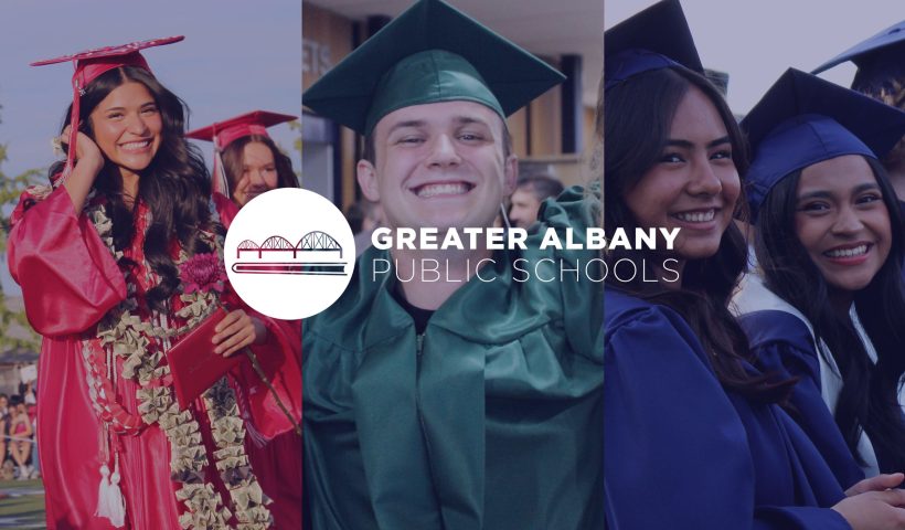 Four graduates from South Albany, Albany Options, and West Albany smile behind the GAPS logo